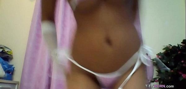  Busty cam girl wearing skimpy bikini reveals her huge milk bombs